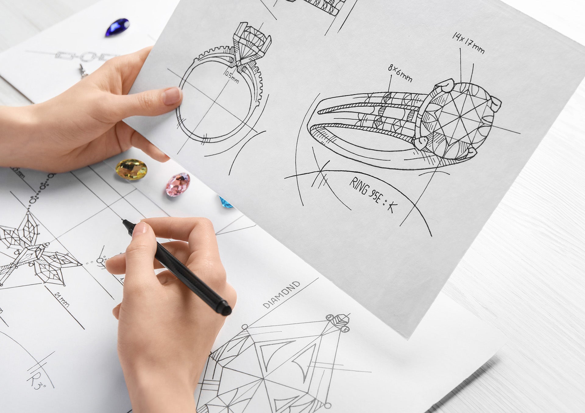 Jewelsmith Sketching a Custom Design