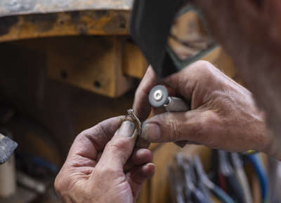Jeweler Using a Dremel to Polish a Ring
