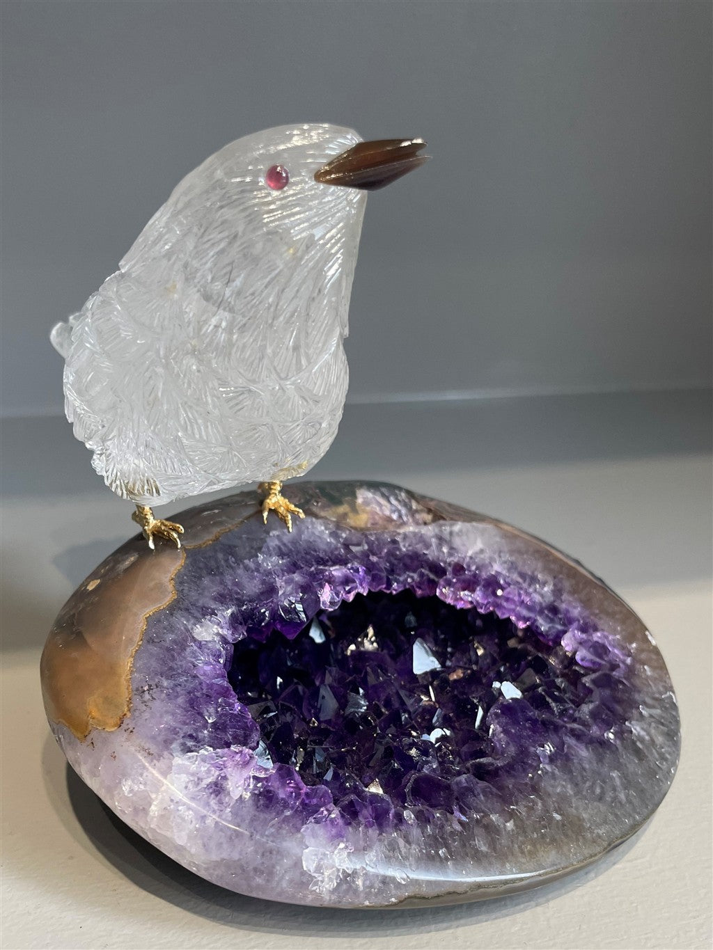 ROCK CRYSTAL BIRD ON AMETHYST GEODE FROM BRAZIL